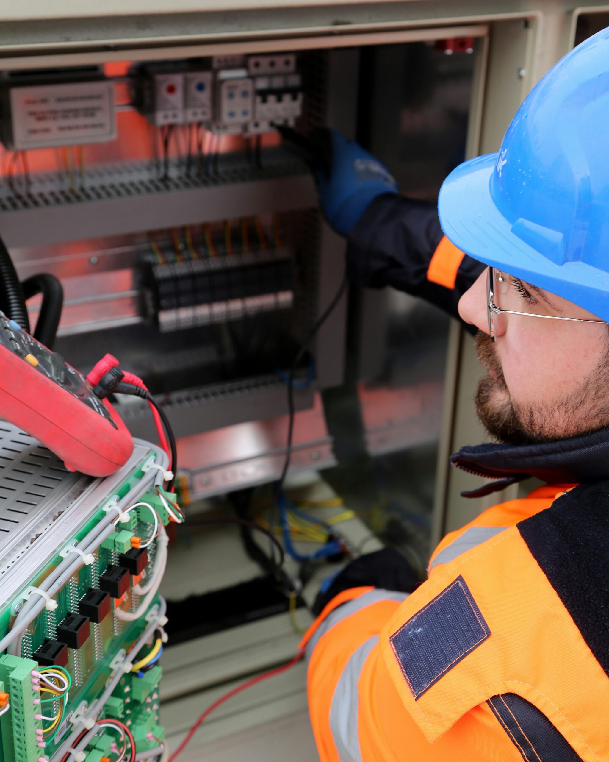 Electrician operating industrial switchboard Brisbane